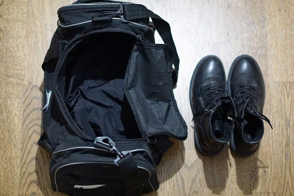 packing shoes in a duffel bag