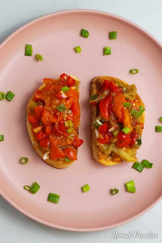 The final Easy Oven-Roasted Eggplant Salad Spread with Peppers & Tomatoes (Salata de Vinete cu Ardei) on two slices of toasted sourdough bread