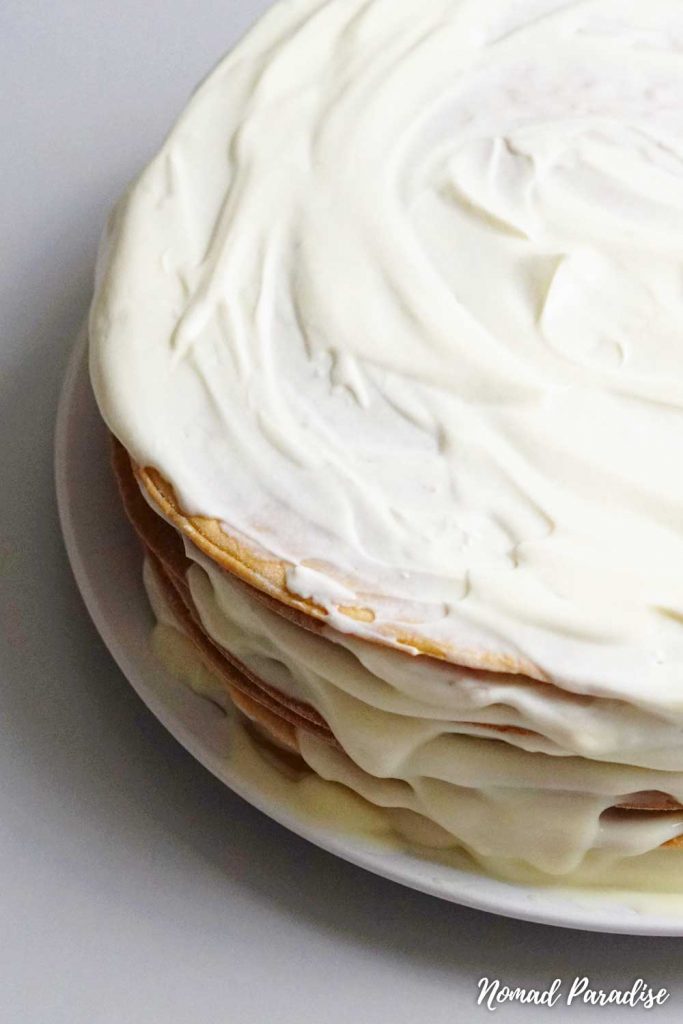 Assembled Russian Honey Cake (Medovik) layers with frosting on top