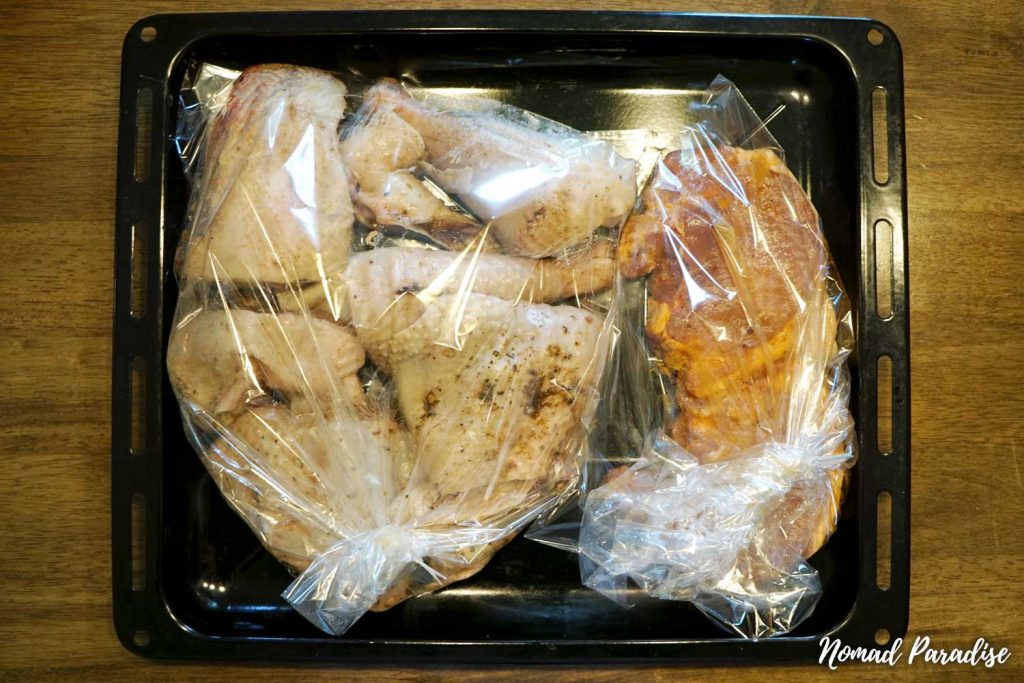 Making chicken noodle soup (the meat is placed in roasting bags on a tray, ready to go in the oven),