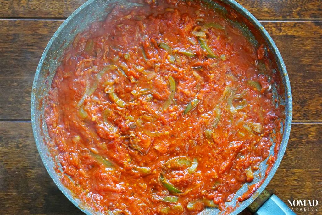 Shakshuka recipe step-by-step (after sauteeing the tomatoes, peppers, and onions).