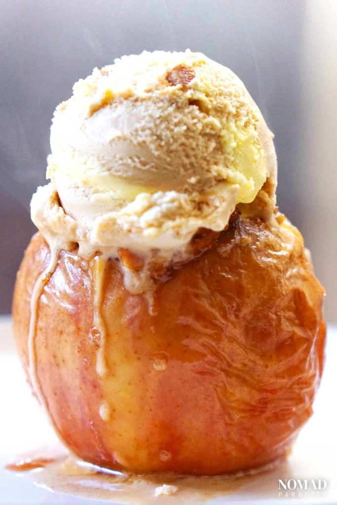 Baked apple with a scoop of ice cream.