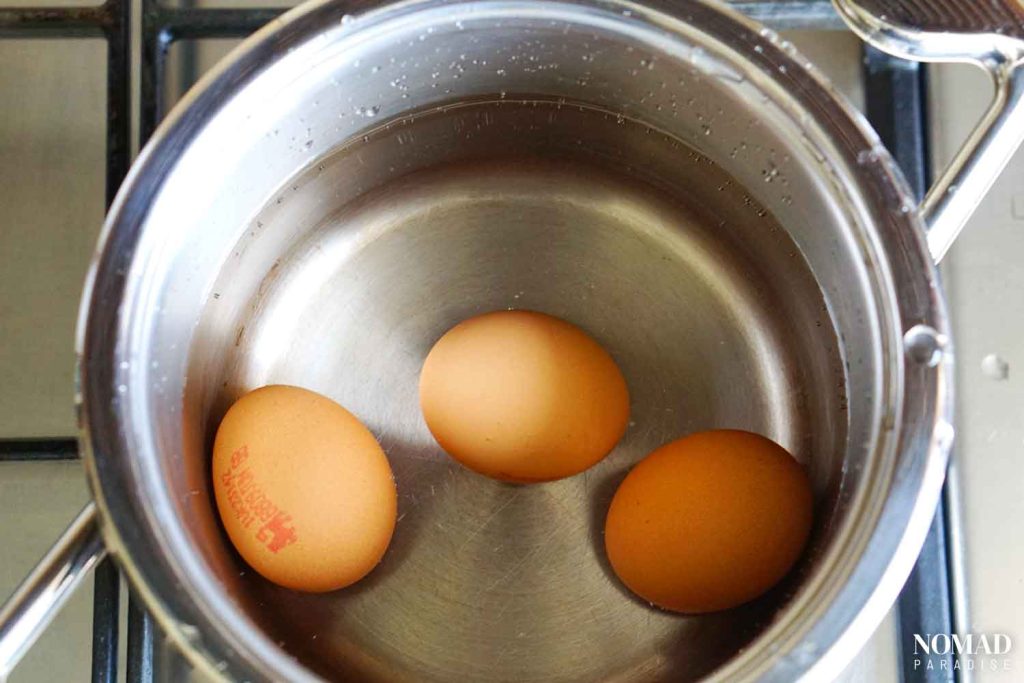 Boiling eggs for rosolje.
