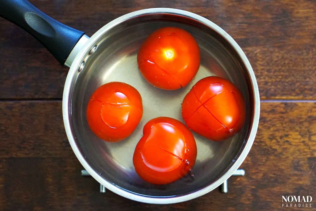 Lutenitsa recipe step-by-step (chilling the tomatoes in cold water).