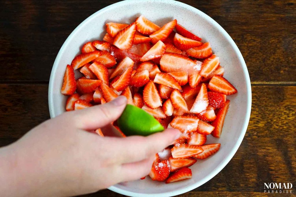 Strawberries and cream step-by-step recipe (adding the lime juice to the strawberries).