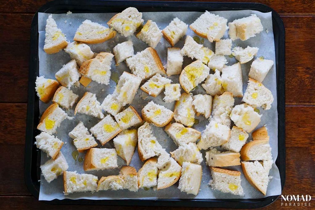 Bread cubes/croutons before toasting them in the oven.