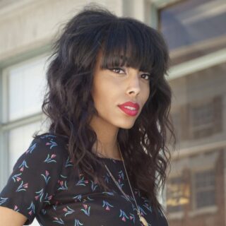 black hairstyle with bangs and layers
