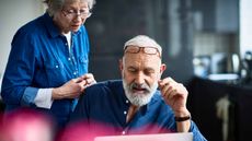 photo of couple looking at laptop