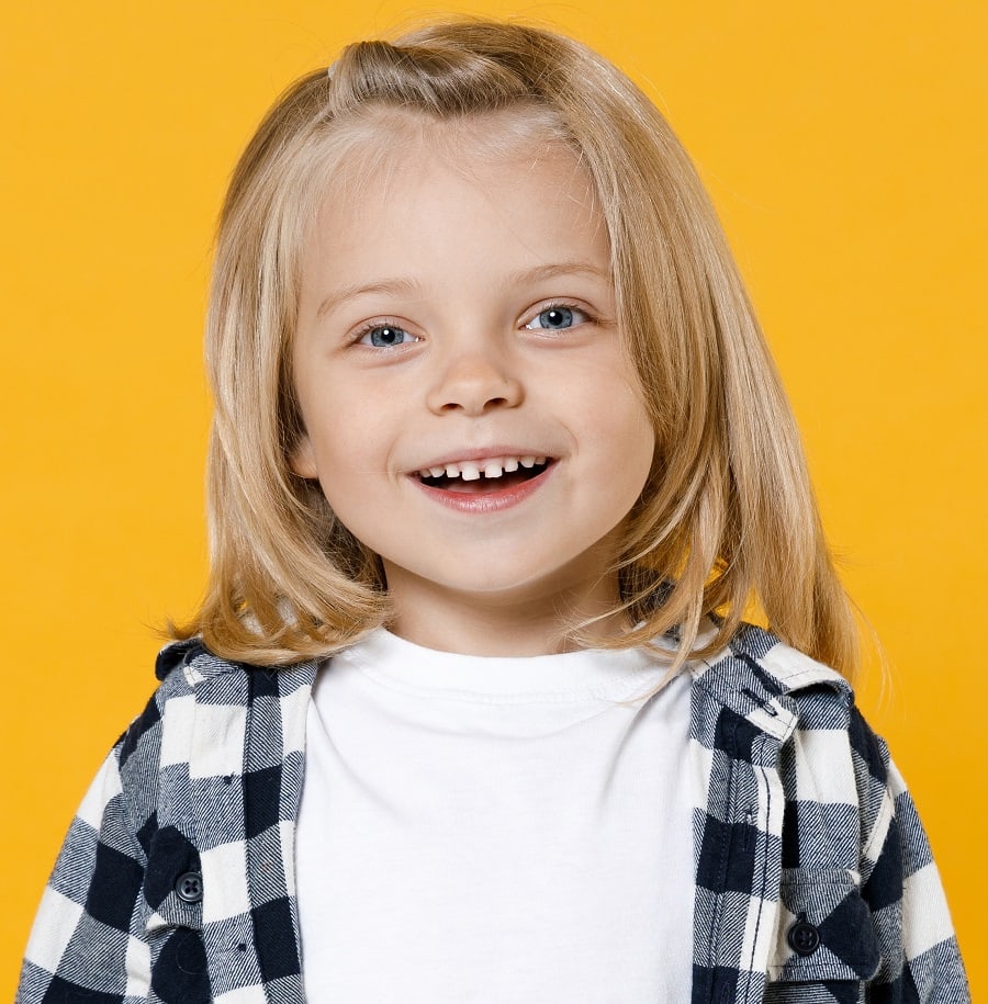 little boy with straight long blonde hair