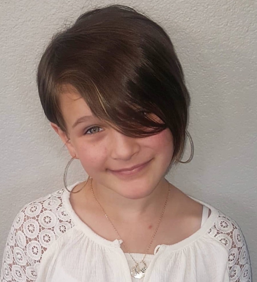 little girl with layered pixie cut