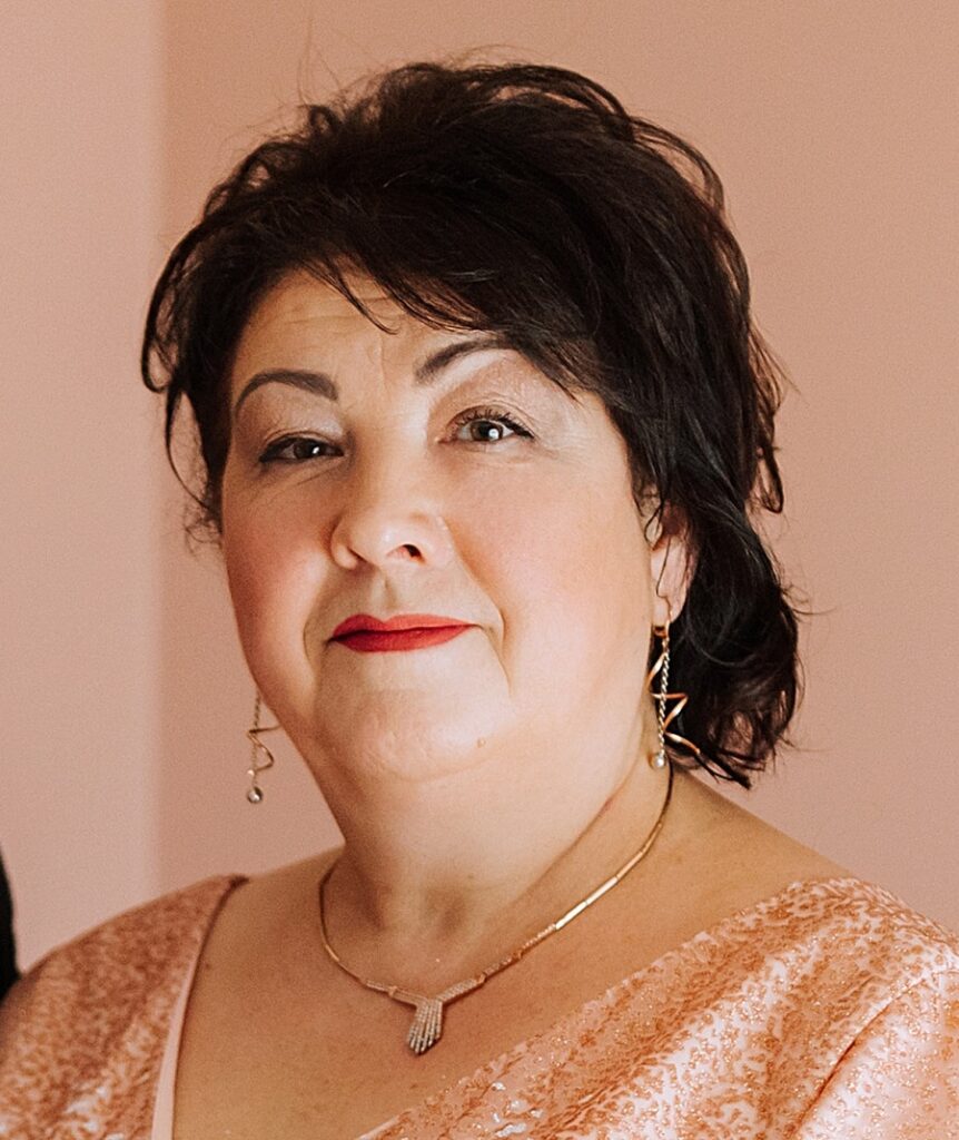 mother of groom with loose updo hairstyle