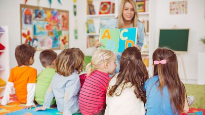 picture of nursery school teacher with preschool children