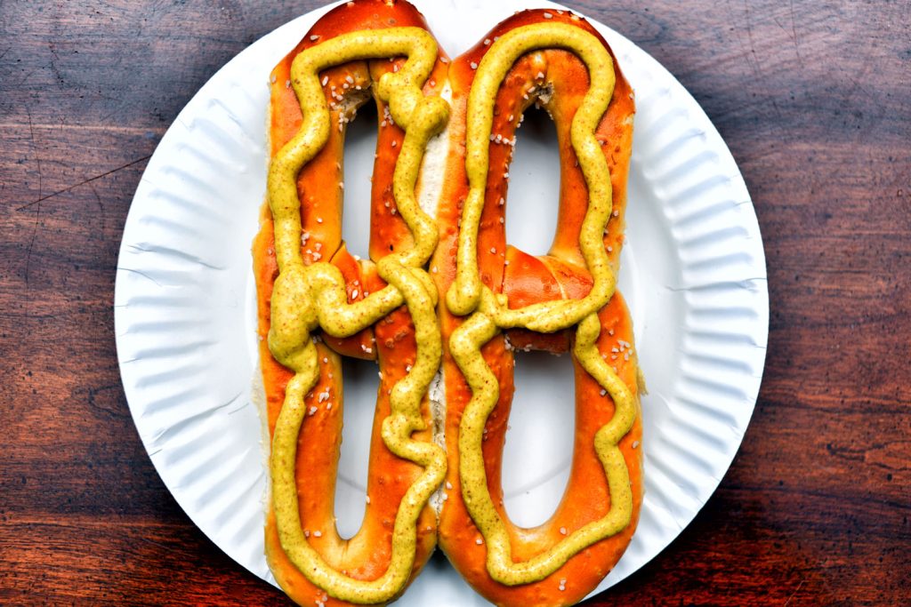 Philadelphia pretzel with mustard on it.