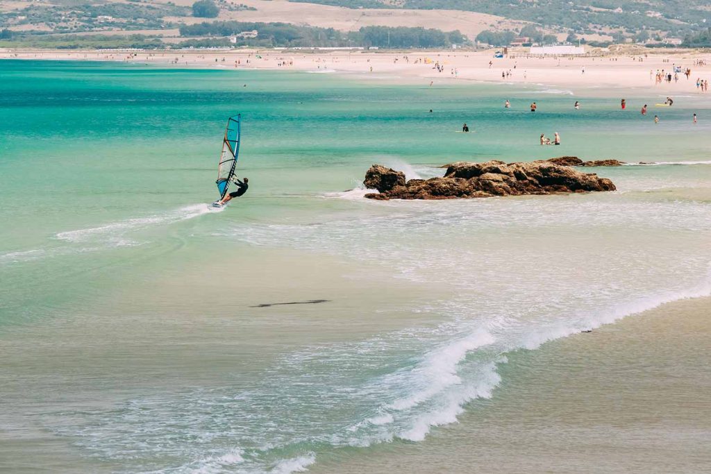 Windsurfing and people on the beach in Tarifa.