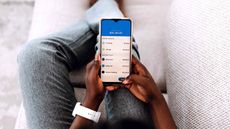 woman checking her online banking app on her phone