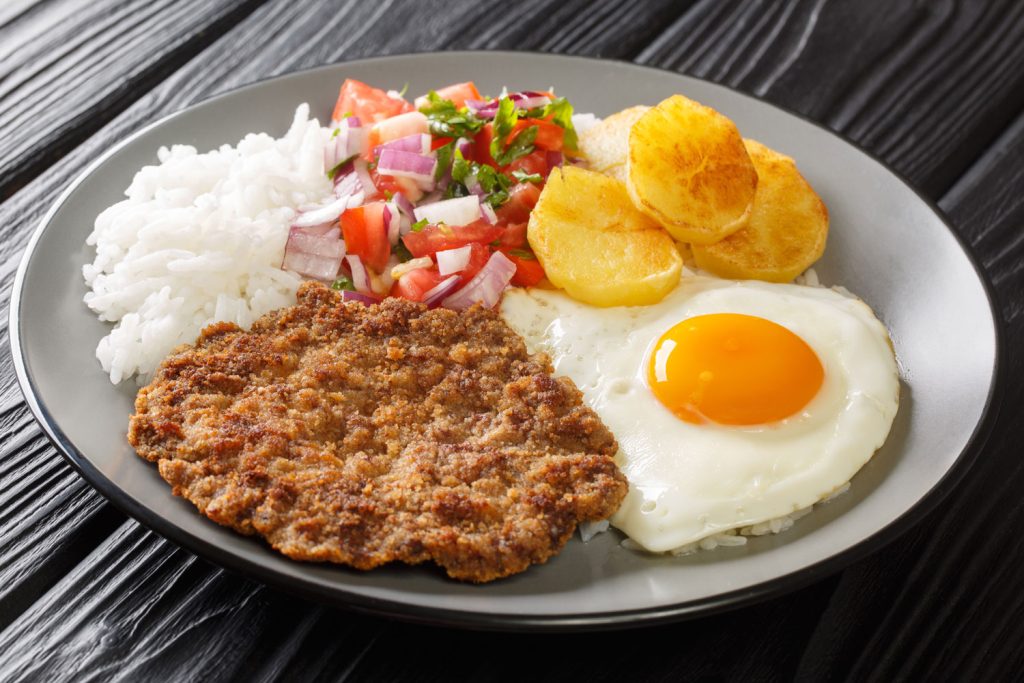 Silpancho (Flattened Steak Topped with Fried Egg and Plantain).