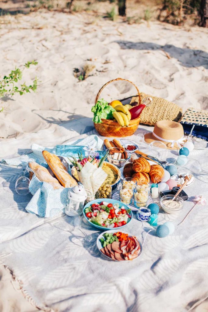 Staycation idea: a picnic outside at the beach.