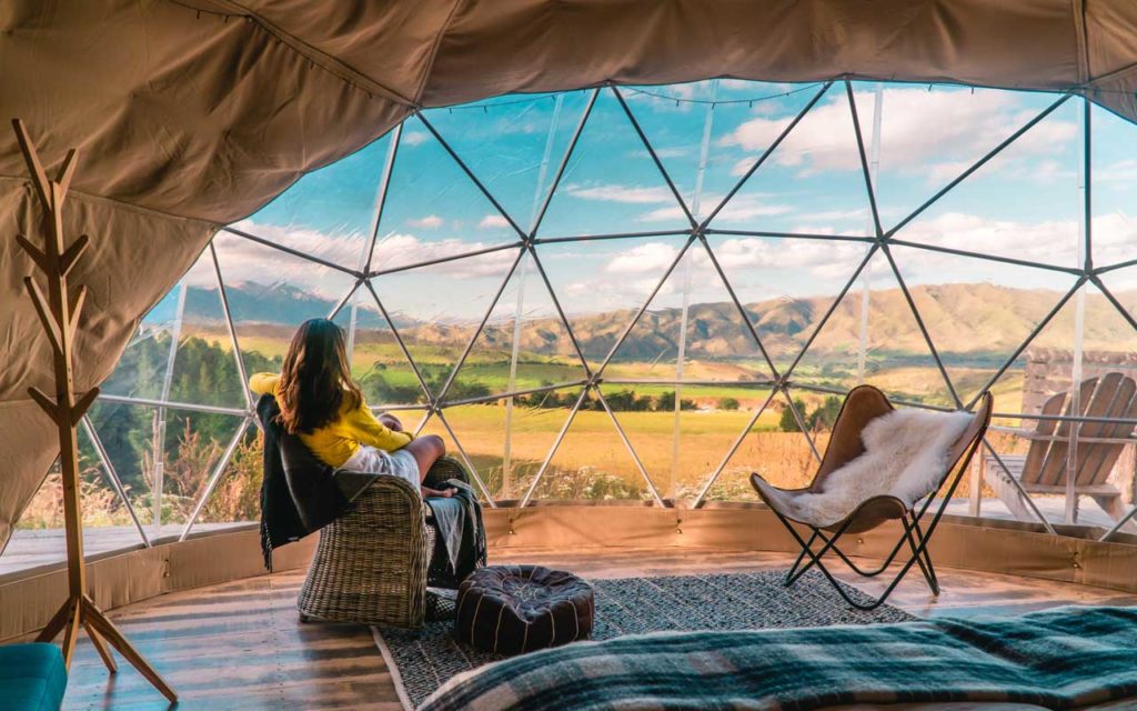 Looking out at the beautiful scenery from a glamping tent.