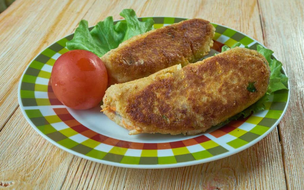 Welsh food: Glamorgan sausages and tomato on a plate