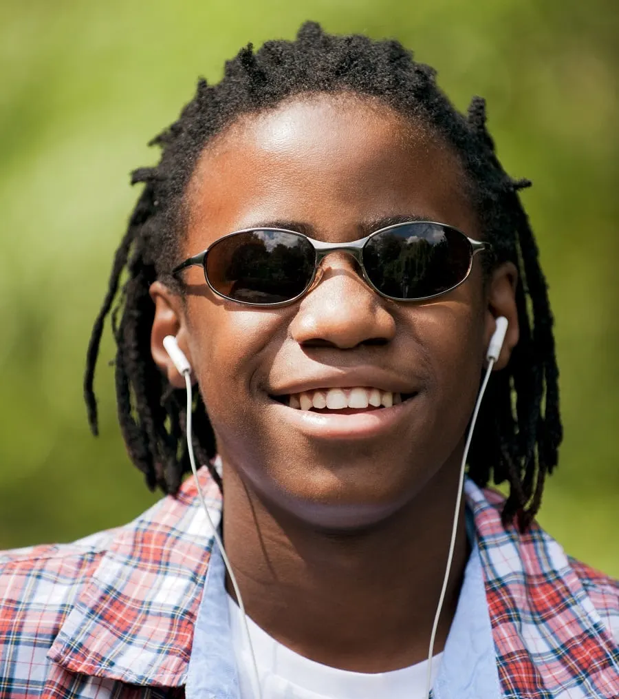 black boy with medium length dreadlocks