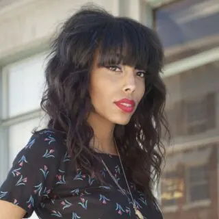 black hairstyle with bangs and layers