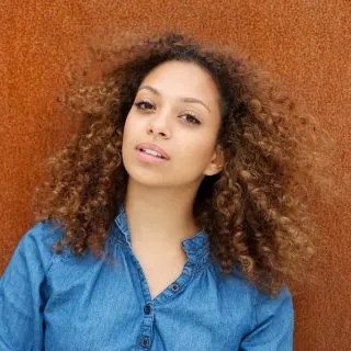 woman with light brown curly hair