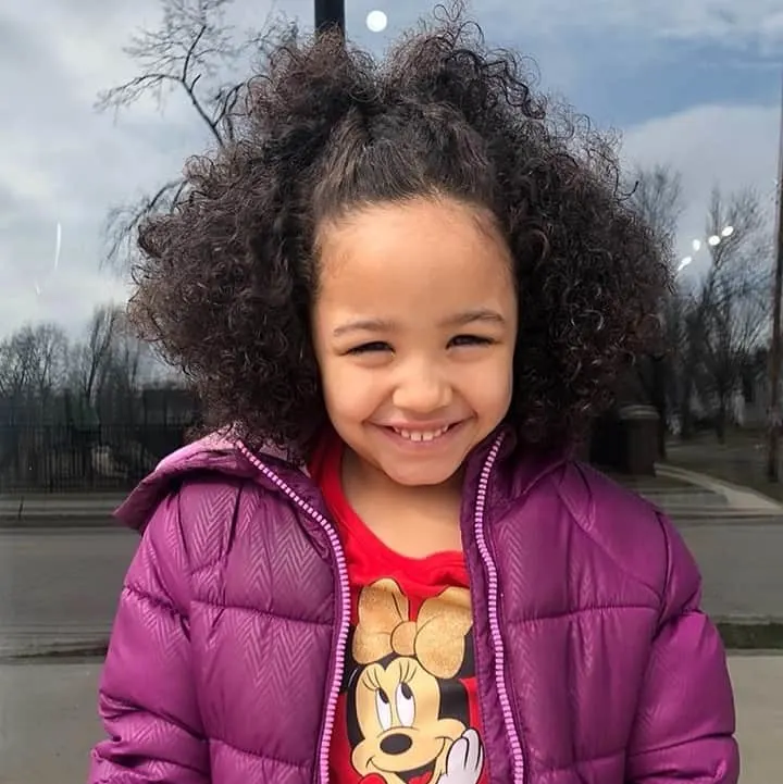 little girl with curly hair