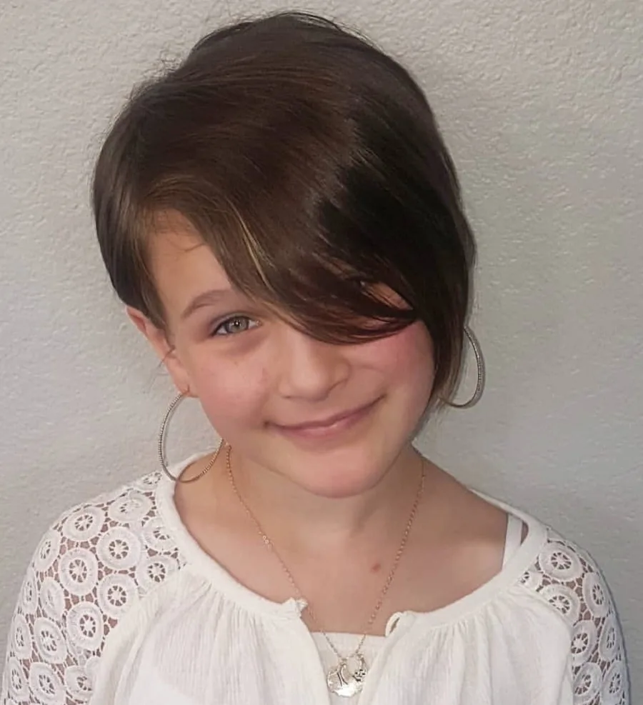 little girl with layered pixie cut