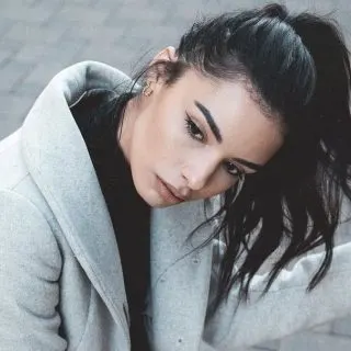 women with messy ponytail