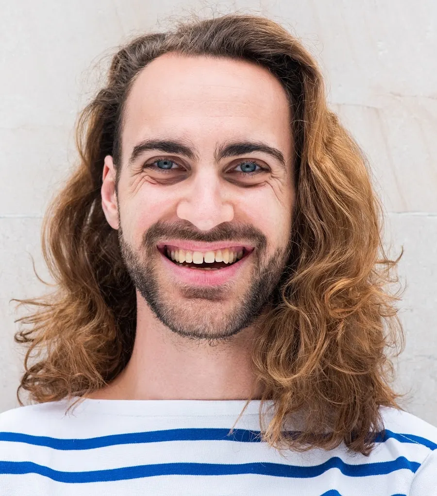 redhead guy with wavy long hair