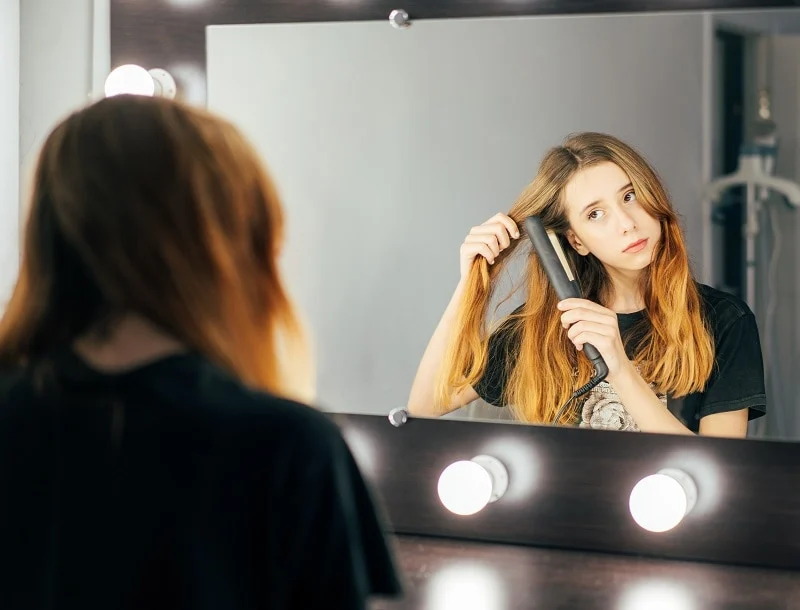 styling curtain bangs with flat iron