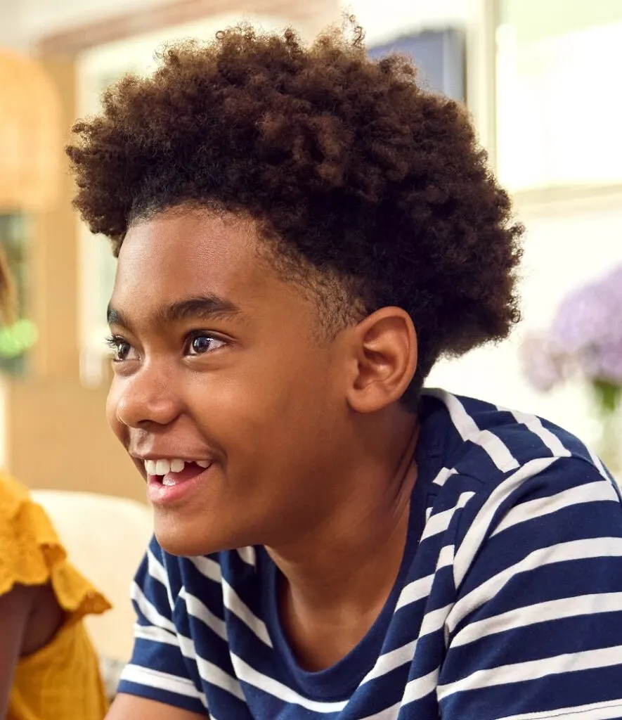 tween black boy curly hair with undercut
