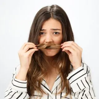 why does my hair smell burnt after I wash it?